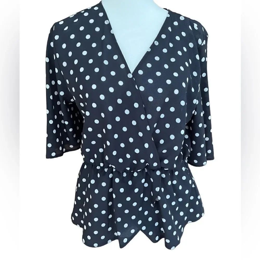 NEXT black/white polka dot peplum style top, size 10